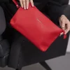 Clutch ecopelle RIBES con logo e cinturino da polso