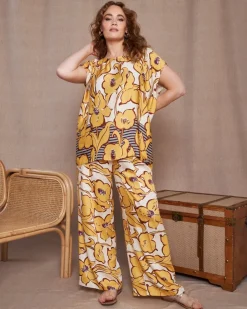 Pantalone a gamba larga in viscosa lucida con fantasia floreale OCRA