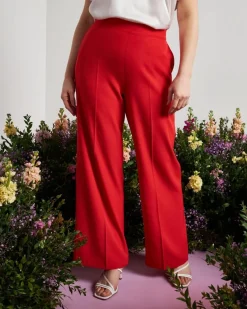 Pantalone a gamba larga in cady elasticizzato tinta unita. PAPAVERO
