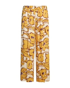 Pantalone a gamba larga in viscosa lucida con fantasia floreale OCRA