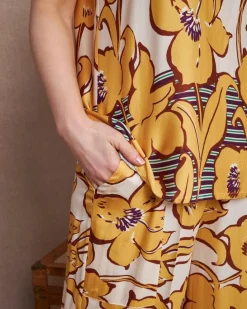 Pantalone a gamba larga in viscosa lucida con fantasia floreale OCRA