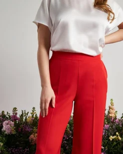 Pantalone a gamba larga in cady elasticizzato tinta unita. PAPAVERO