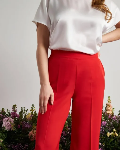 Pantalone a gamba larga in cady elasticizzato tinta unita. PAPAVERO