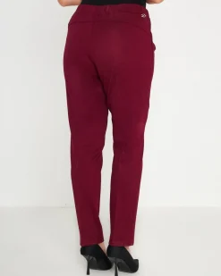 Pantaloni slim fit con vita elastica e dettaglio frontale di piega di